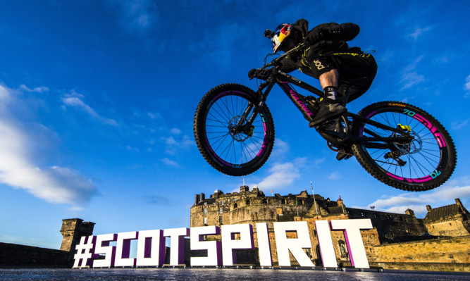 Professional street trials stunt cyclist Danny Macaskill shows off his skills at Edinburgh Castle Esplanade.