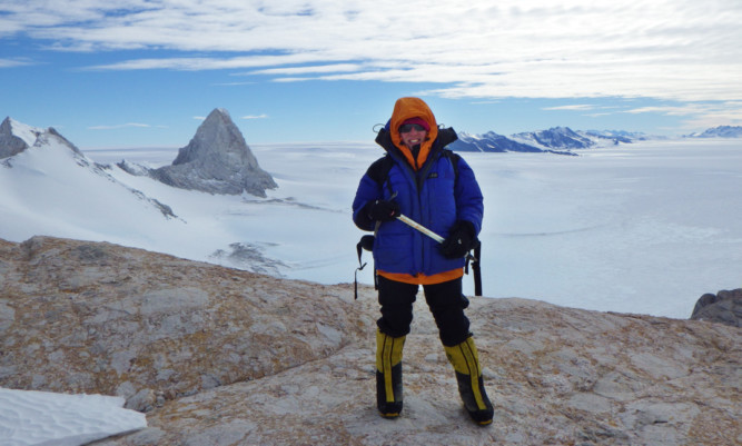 Kate on top of Marble Hills, Antarctica, where her team collected rock samples.