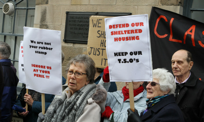 Pensioners protesed outside the Town & County Hall in Forfar against the cuts.