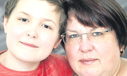 Young fundraiser Toby Etheridge and his mum, Alison.