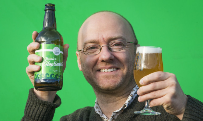 Scottish Green Party co-convener Patrick Harvie unveils his own line of beer, named 'Harvie's Hoptimistic'.