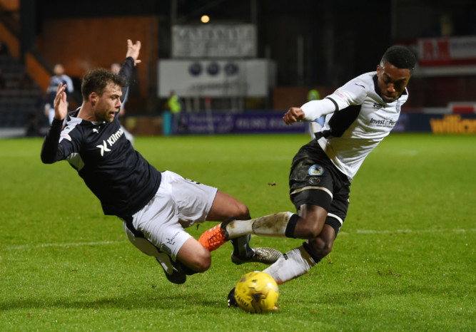 Dundee's Rory Loy challenges for the ball with St Johnstone's Darnell Fisher.