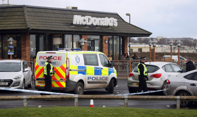 Police at McDonalds in Arbroath where a five men were detained in connection with an ATM raid in Carnoustie.