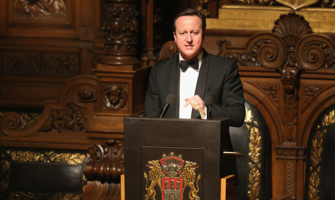 Prime Minister David Cameron speaks at the annual Matthiae-Mahl dinner at Hamburg City Hall.