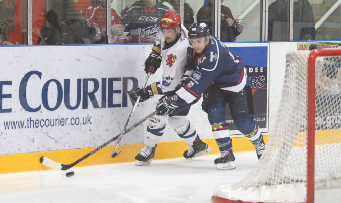 Stars Jason Gray and Capitals Ned Lukacevic tussle.