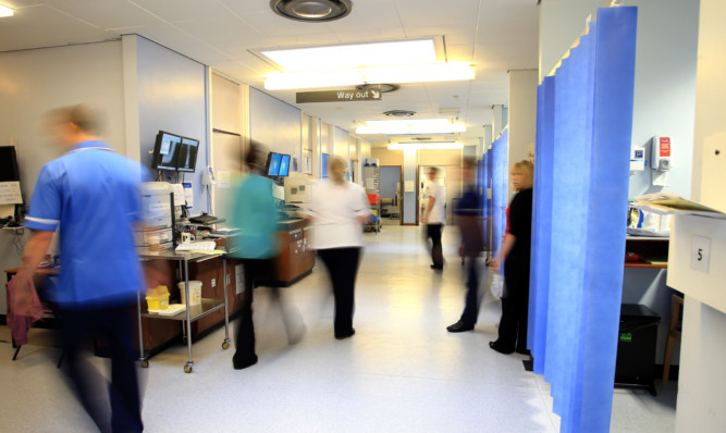 Delayed discharge of patients adds additional pressure in busy hospital wards: Peter Byrne/PA Wire.