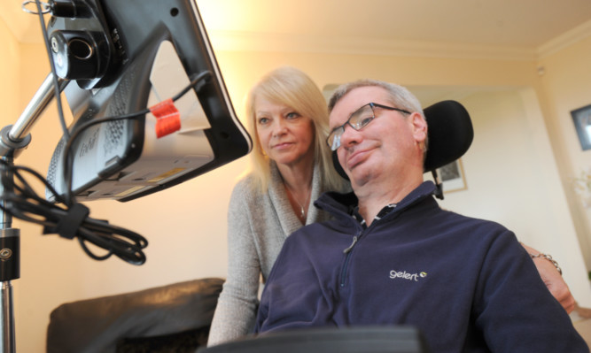 Linda and Andy Lennon at their home in Forfar. Andy has lost his fight with MND at the age of 61.