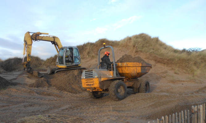 The restoration work at the world-famous West Sands in St Andrews gets under way.
