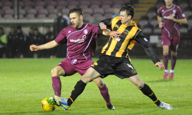 Mark Whatley (left) in action for Arbroath.