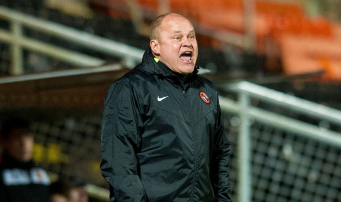 Dundee United manager Mixu Paatelainen gives orders to his players.