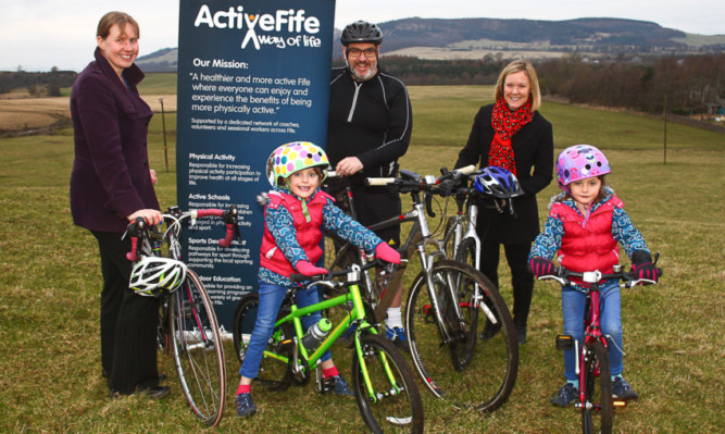 Councillor Mark Hood with his daughters, Lily and Daisy, and cycling development officer Kirsteen Torrance, left, and Sarah Roxburgh, head of community use schools in the area.
