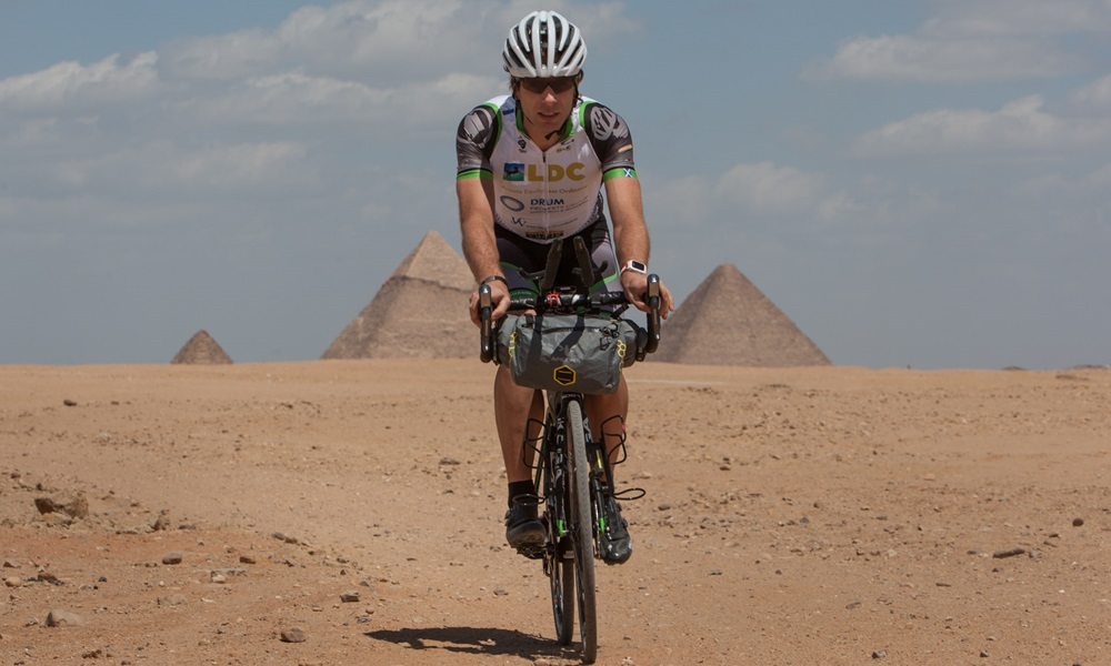 Scottish adventurer Mark Beaumont cycles his Koga bicycle in front of the Pyramids of Giza, the day before departing on his Africa Solo expedition to try and set the Cairo to Cape Town World (speed) record, in Cairo, Egypt, 9 April 2015. The current World Record stands at 59days 8 hours, Mark plans to do the 10,000km distance, through 8 African countries, in sub-50 days. For further information please refer to www.markbeaumontonline.com or Telephone Mark on +44-7979-836473.