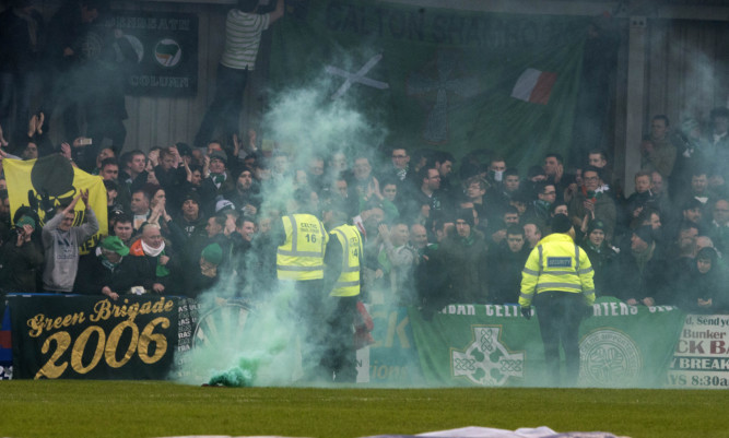 Flares were let off during the fourth round match at Stair Park.