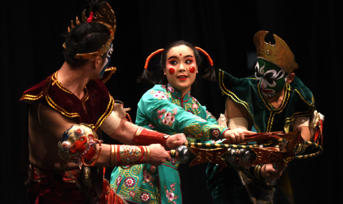 Performers from the Chongqing Chuanju Theatre put on a show as part of the opening ceremonies.