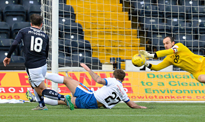 Kilmarnock goalkeeper Jamie MacDonald saves from Dundee's Paul McGowan.