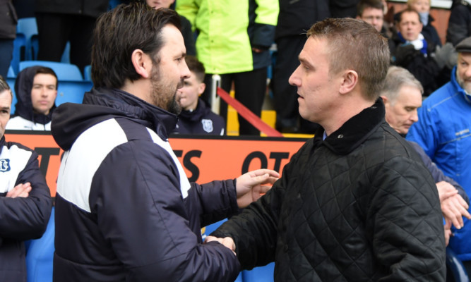 Paul Hartley shakes hands with new Kilmarnock manager Lee Clark.