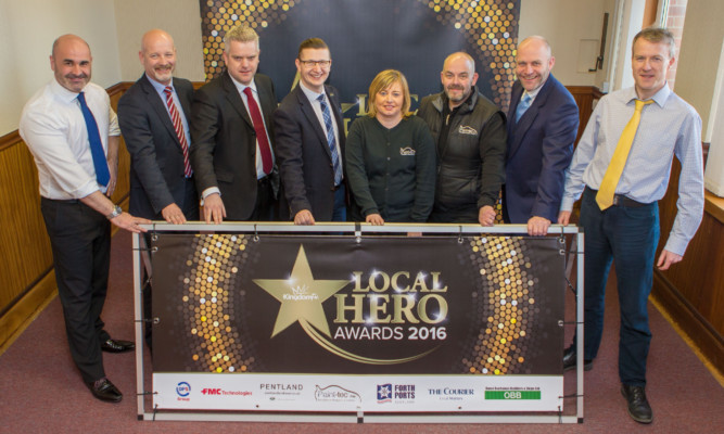 Pictured (from left) - John Leitch and Fraser Thornhill of Pentland  Land Rover in Cupar; David Webster, of Forth Ports; Darren Stenhouse station manager at Kingdom FM; Lynda and Stuart Campbell of Paint-Tec, Glenrothes; Colin Millar of the DPS Group, and Michael Alexander of The Courier.