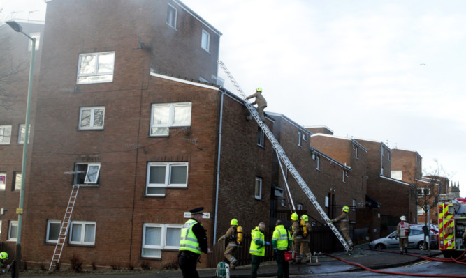 The emergency services at the scene on Sunday.