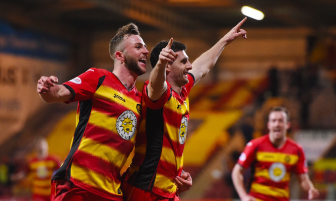 Kris Doolan (centre) celebrates with Christie Elliott.