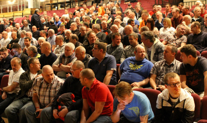 Workers at an emergency staff meeting last April after Tullis Russell's problems had become clear.