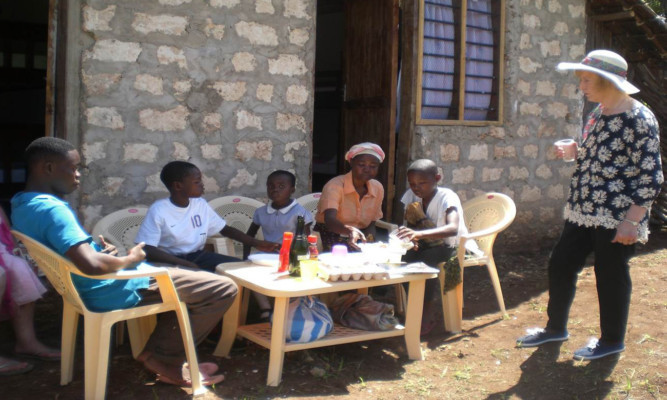 Margaret meeting the Kenyan family at their new home.
