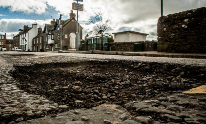 A pothole on the one of the main roads in Dunning.