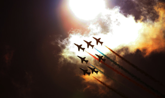 The Red Arrows during a display at the RAF Leuchars Airshow in 2012.