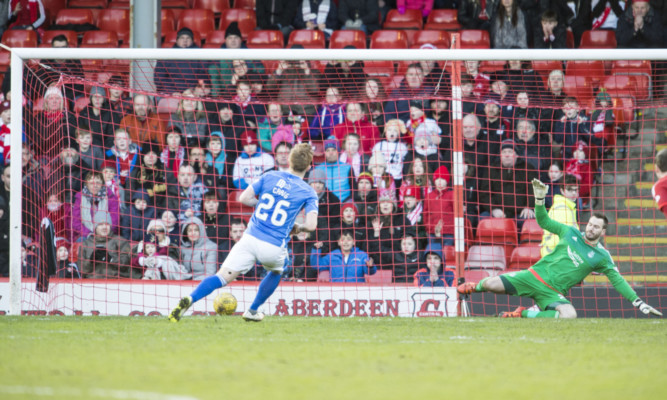 Liam Craig scores his late penalty.