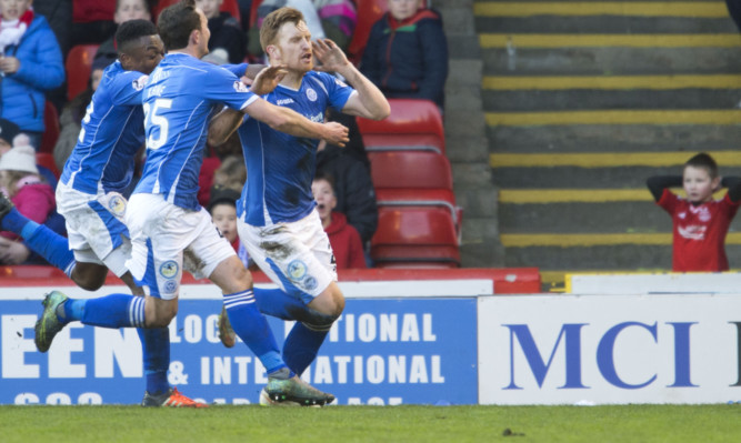 Liam Craig celebrates his goal, leaving at least one Aberdeen fan stunned.