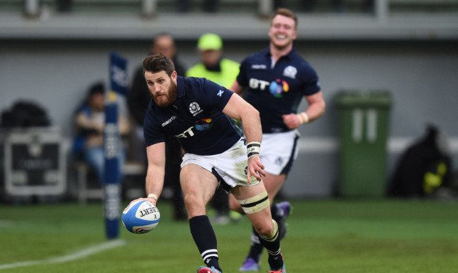 Tommy Seymour scores the clinching try after Stuart Hogg's off-load put him in.