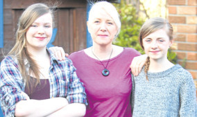 Fiona Henderson with her twin daughters Emma and Amy.