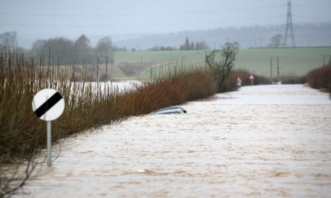 A car submerged under the water at Butterybank near Coupar Angus  after the River Isla burst its banks in January.