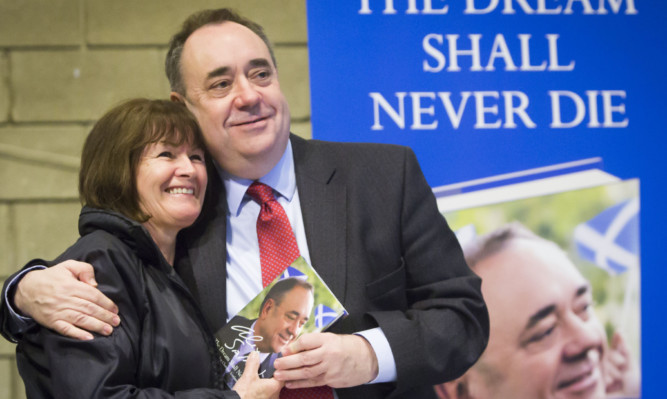 Former leader Alex Salmond has his picture taken as he signs copies of his book The Dream Shall Never Die during the last SNP conference at the SECC.