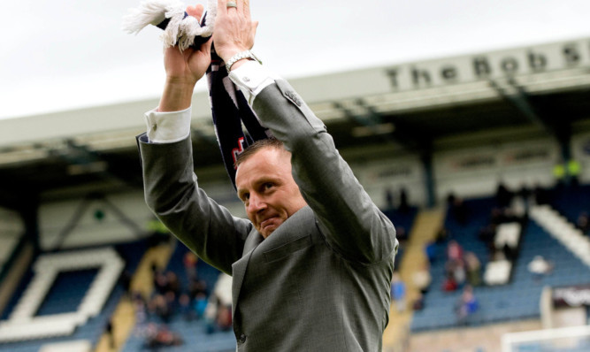 Dundee legend Rab Douglas applauds the fans during an emotional lap of honour at half-time as he prepares to leave the club.