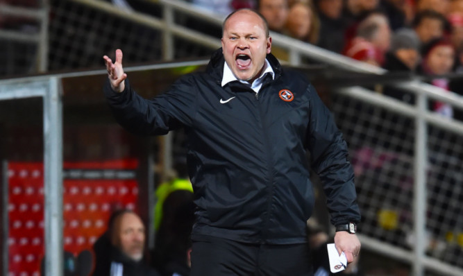 United manager Mixu Paatelainen roars his players on against Aberdeen.
