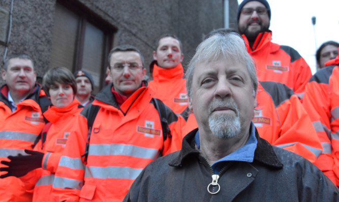 David Mitchell with workers who walked out of the Royal Mail sorting office in Cupar in January to show their support for their former colleague.