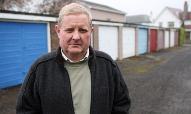 John McMillan in front of the garages off Grove Road in Broughty Ferry.