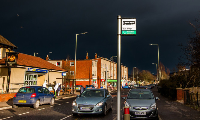 The bus stop on Rannoch Road where the pensioner was assaulted.