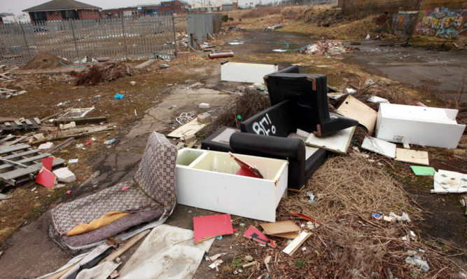 Fly-tipping on the former Valentines factory site at Dunsinane Industrial Estate.
