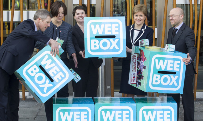 First Minister Nicola Sturgeon, Labour leader Kezia Dugdale, Liberal Democrat leader Willie Rennie and Conservative leader Ruth Davidson and Green Party convenor Patrick Harvey, will pose with giant WEE BOXES to highlight their support for SCIAF.