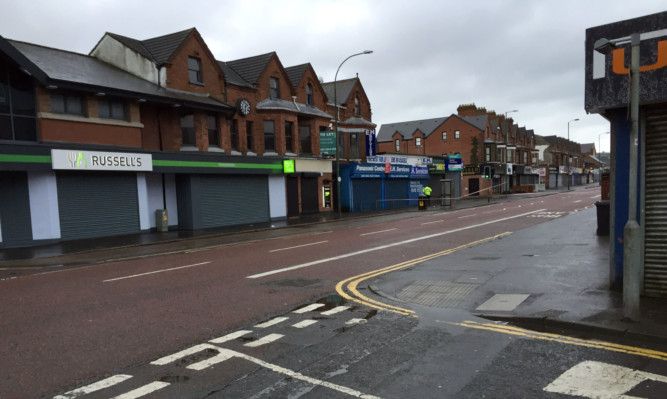 Police have sealed off a large area after a device exploded under a car in east Belfast.