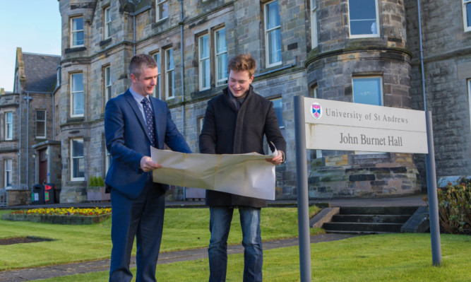 Director of residential and business services Ben Stuart (left) shows Pat Mathewson, students association president, plans for new accomodation for 900 students in the town.