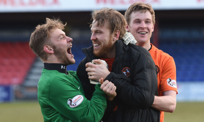 Luis Zwick (left) celebrates with Henri Anier and Paul Dixon at full-time.