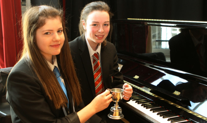 Caitlin Stewart and Lauren Anderson with the Arbroath Festival Trophy.