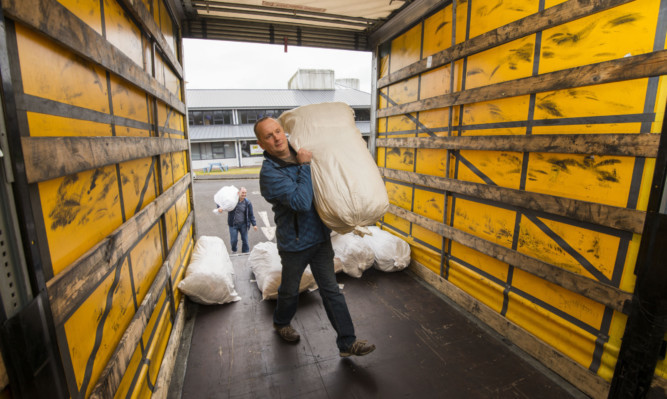 Mike Strachan starts loading the lorry taking the aid shipment to Serbia.