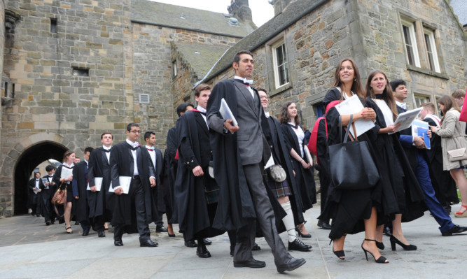 26.06.15 - pictured in St Salvador's Quad, North Street, St Andrews after the latest graduation ceremony for St Andrews University students - the procession arrives in the quad