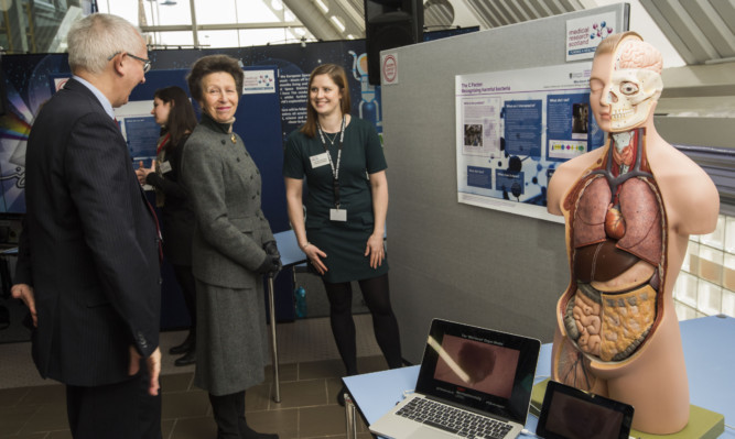 The Princess Royal chats to Prof Philip Winn Chairman of Medical Research Scotland and Jaclyn Carberry from the University of Glasgow.