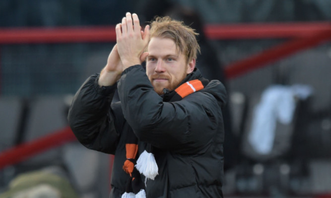 Henri Anier celebrates at full-time in Dingwall.