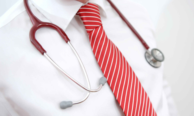 A Stethoscope hangs around a neck **EDTORS PLEASE NOTE IMAGE POSED BY MODEL**