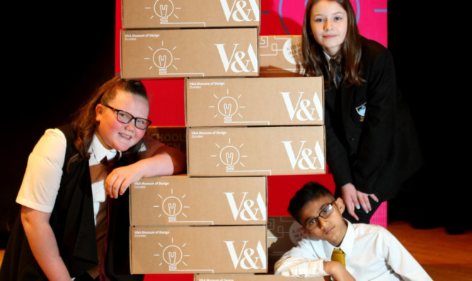 Rachel Glen, Lucy Bertie and Uwais Din at Craigie High with some of the resource packs.